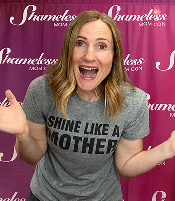 Sara Dean wearing Shameless Mom merchandise infront of curtain for Shameless Mom Con Virtual Event